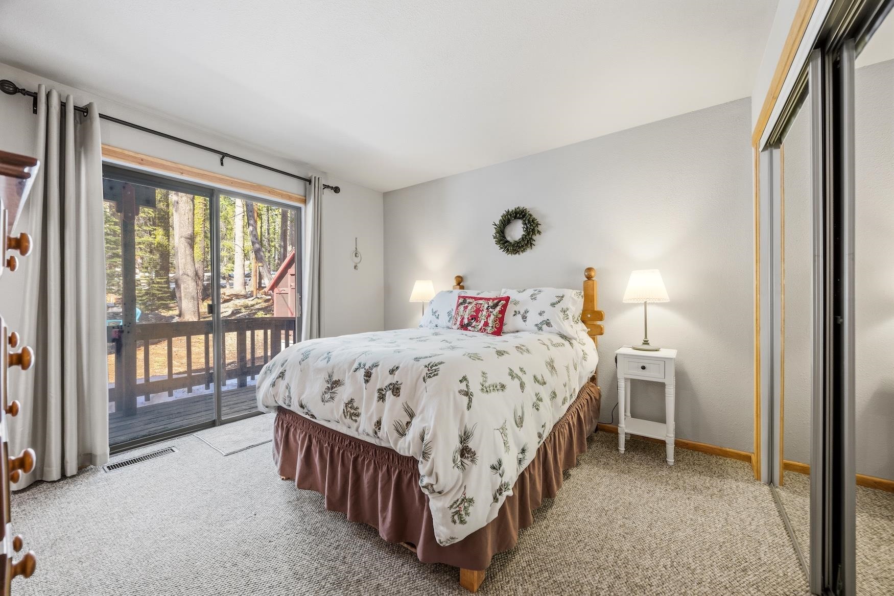 21146 Donner Pass Road Soda Springs, CA 95728 - Photo 13 of 25 a bed sitting in a bedroom next to a window