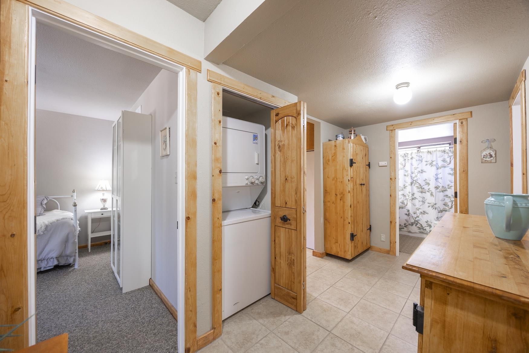 21146 Donner Pass Road Soda Springs, CA 95728 - Photo 14 of 25 a view of a hallway with furniture and a livingroom