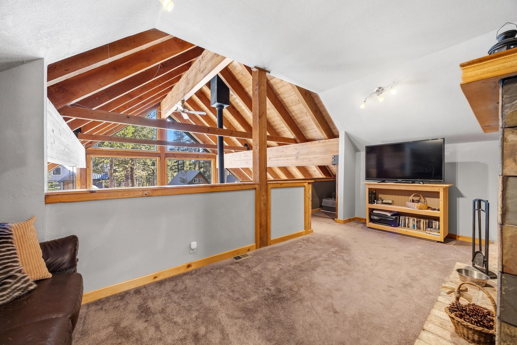 21146 Donner Pass Road Soda Springs, CA 95728 - Photo 16 of 25 a view of a livingroom with furniture and a flat screen tv
