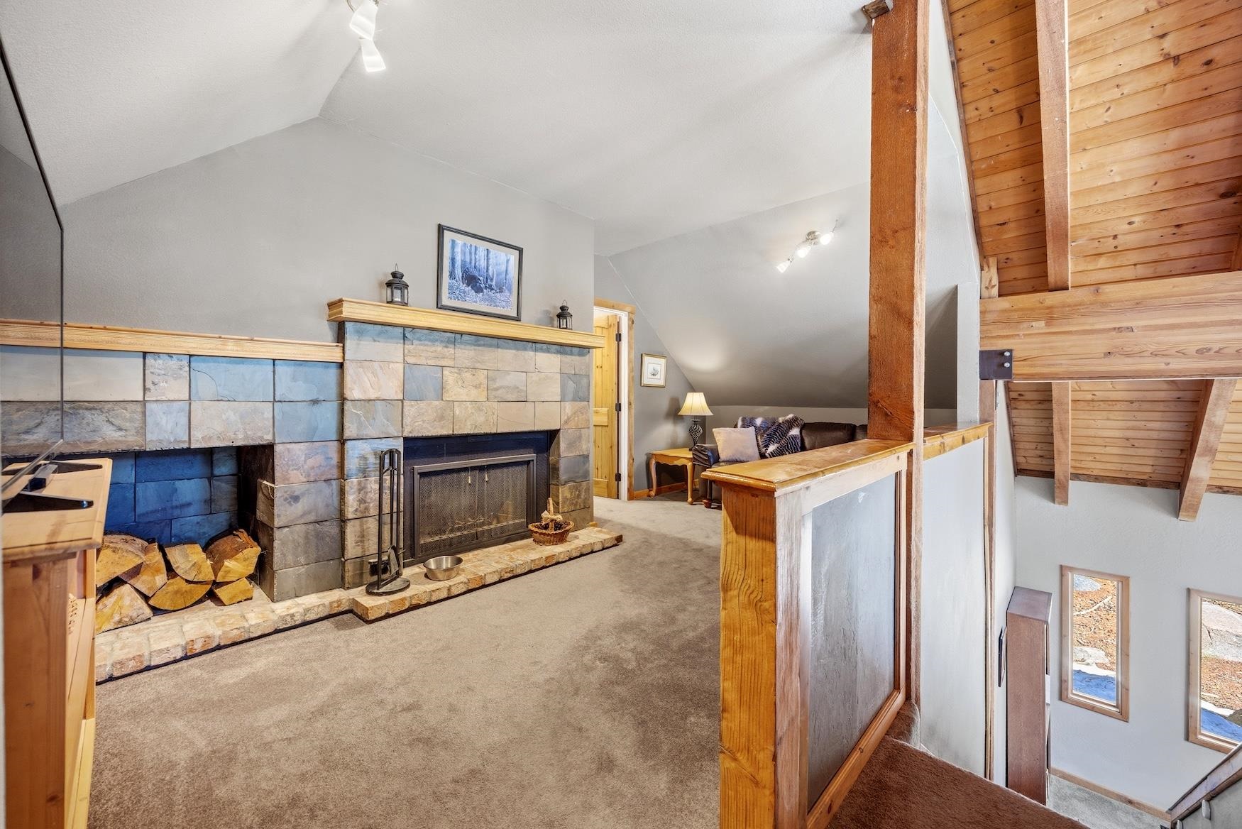 21146 Donner Pass Road Soda Springs, CA 95728 - Photo 17 of 25 a view of a livingroom with fireplace and a window