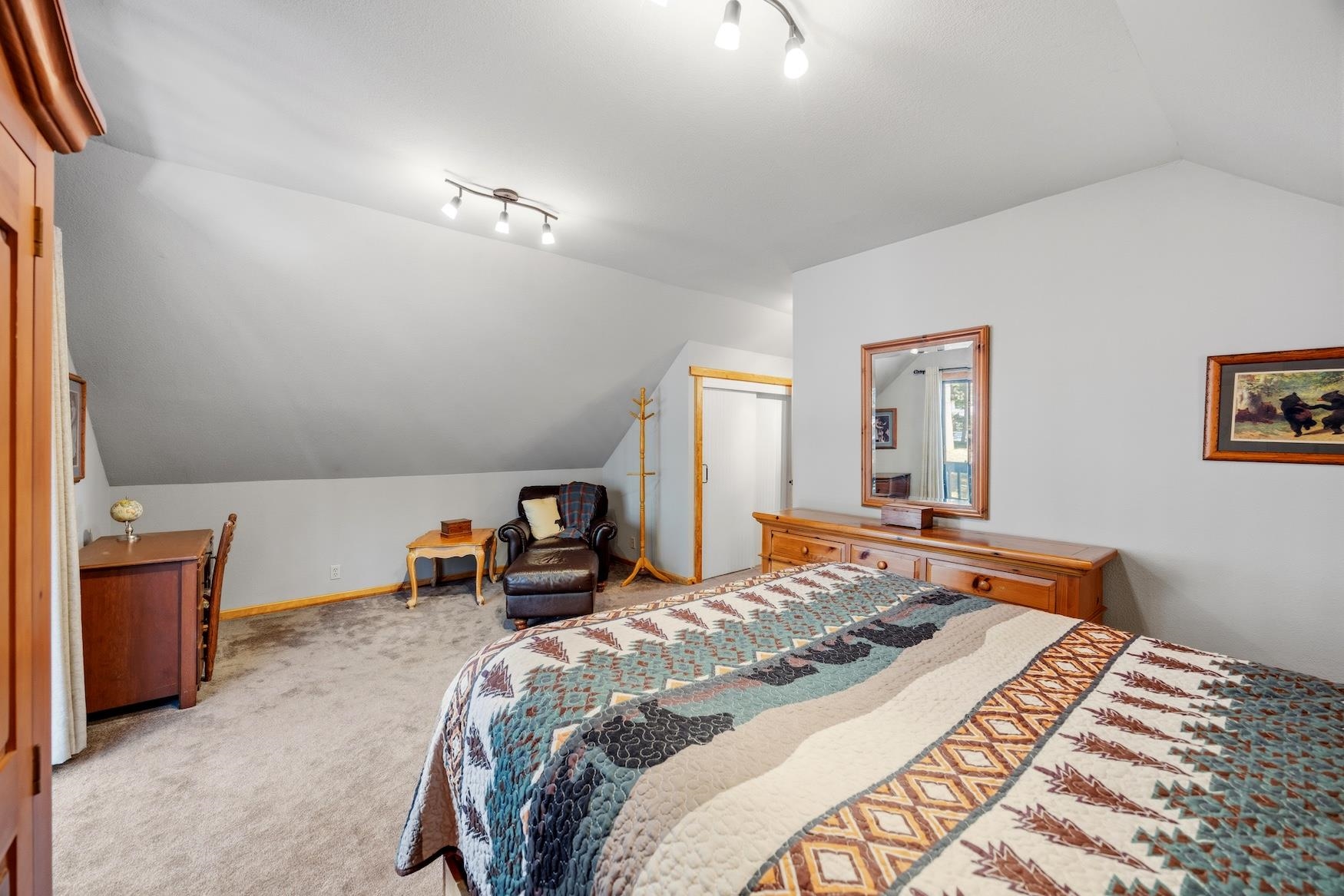 21146 Donner Pass Road Soda Springs, CA 95728 - Photo 19 of 25 a bedroom with a bed and a couch