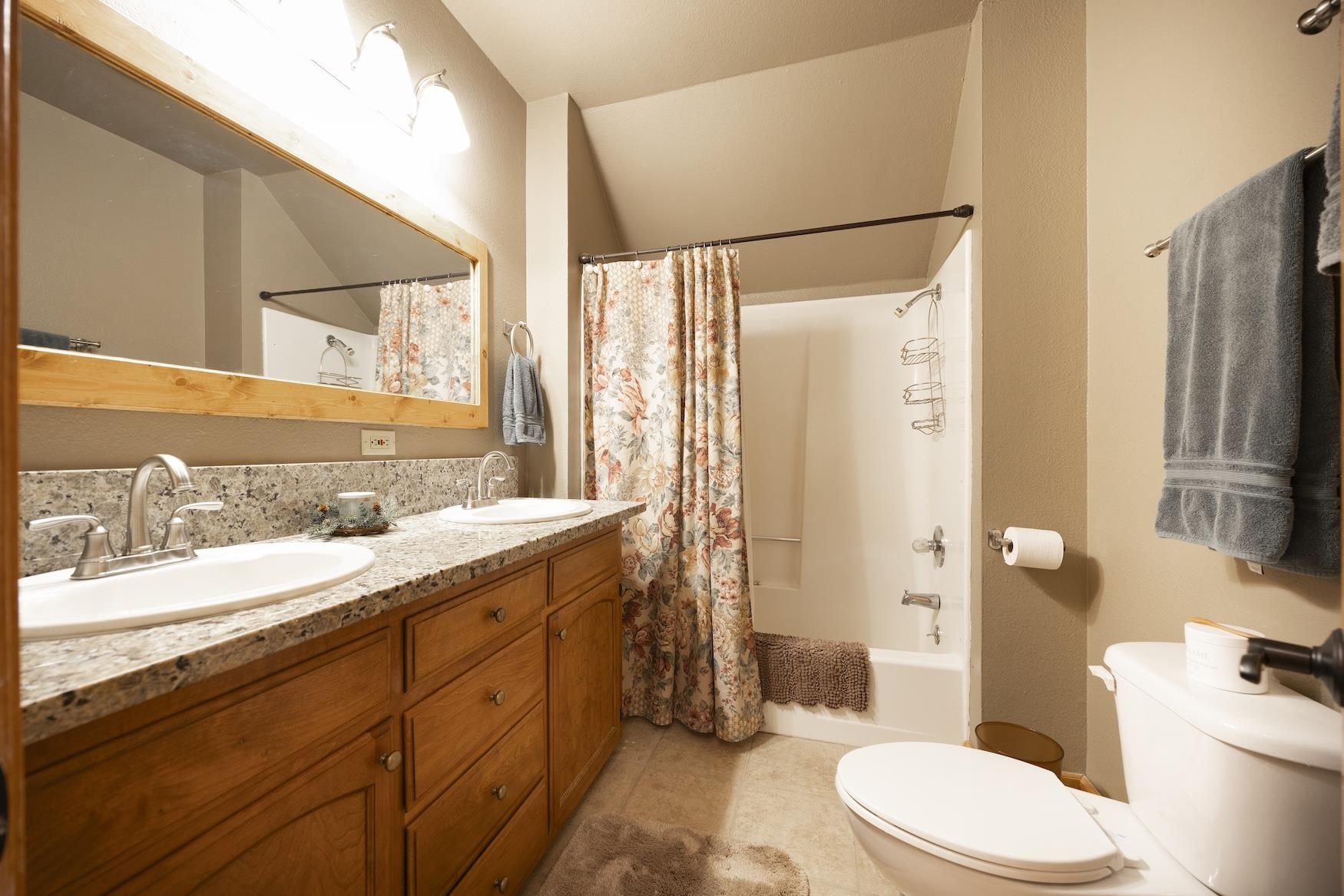 21146 Donner Pass Road Soda Springs, CA 95728 - Photo 20 of 25 a bathroom with a granite countertop sink toilet and shower