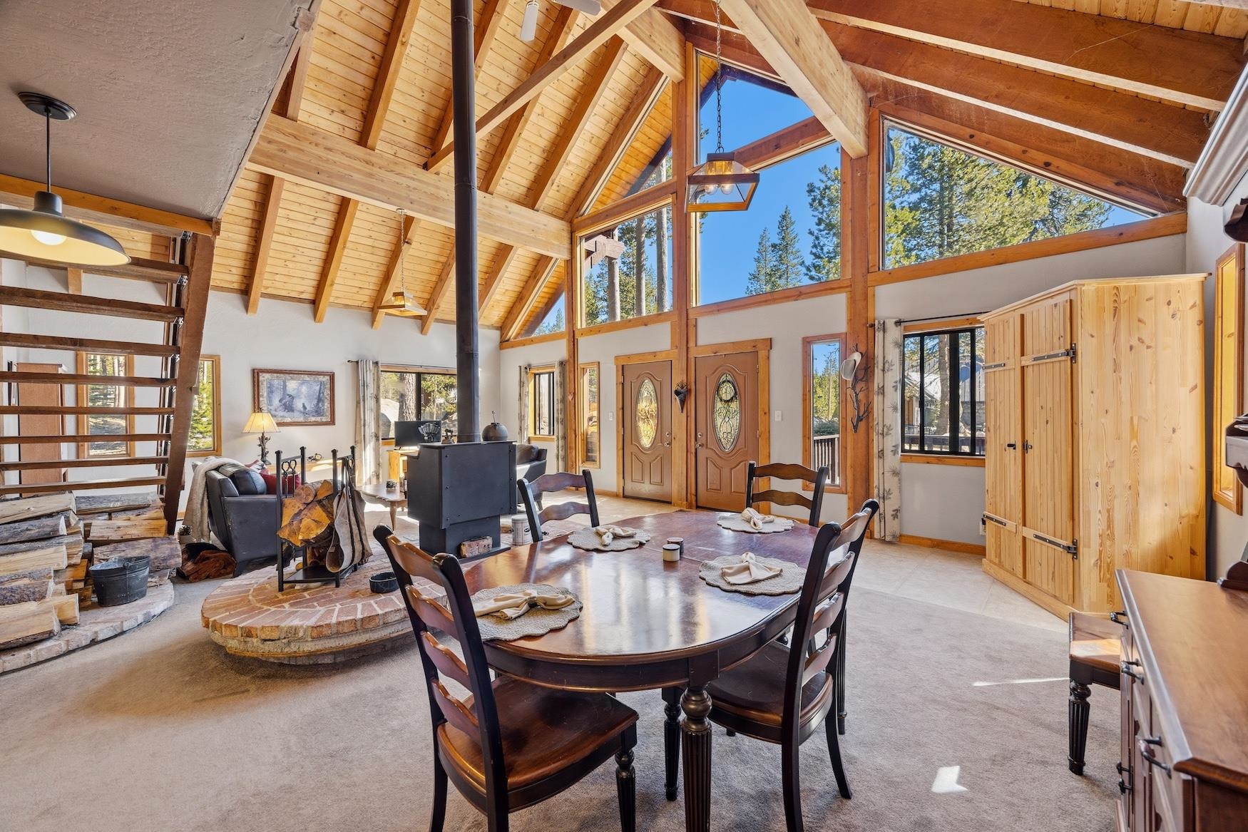 21146 Donner Pass Road Soda Springs, CA 95728 - Photo 3 of 25 a dining room with furniture water view and a large window