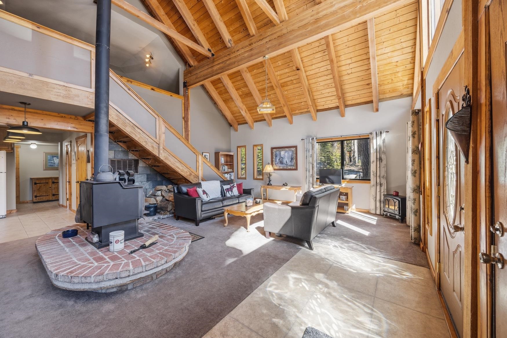 21146 Donner Pass Road Soda Springs, CA 95728 - Photo 4 of 25 a living room with furniture and a table