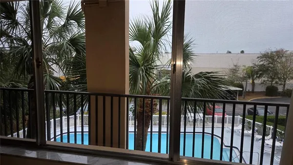 a view of a swimming pool with a lounge chairs