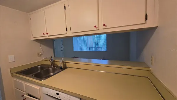 an empty room with a empty space and windows