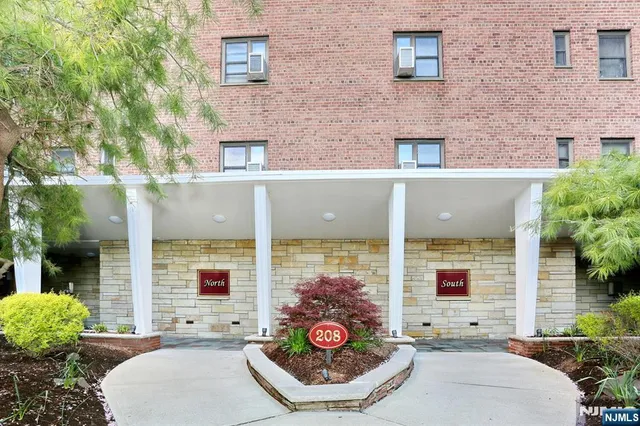 a view of a patio with couches table and chairs and potted plants