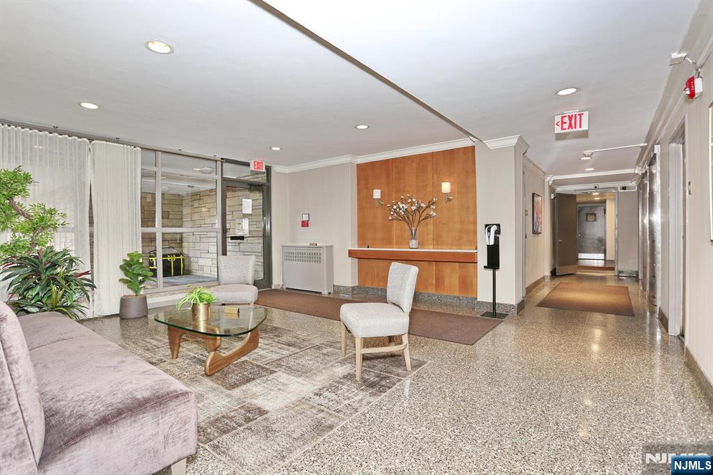 208 Anderson Street, Unit S4F Hackensack, NJ 07601 - Photo 16 of 20 a living room with furniture and a potted plant