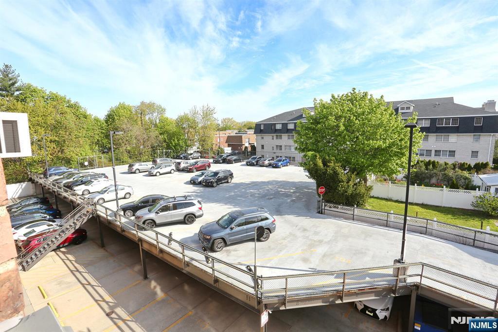 208 Anderson Street, Unit S4F Hackensack, NJ 07601 - Photo 20 of 20 a terrace with outdoor seating and trees