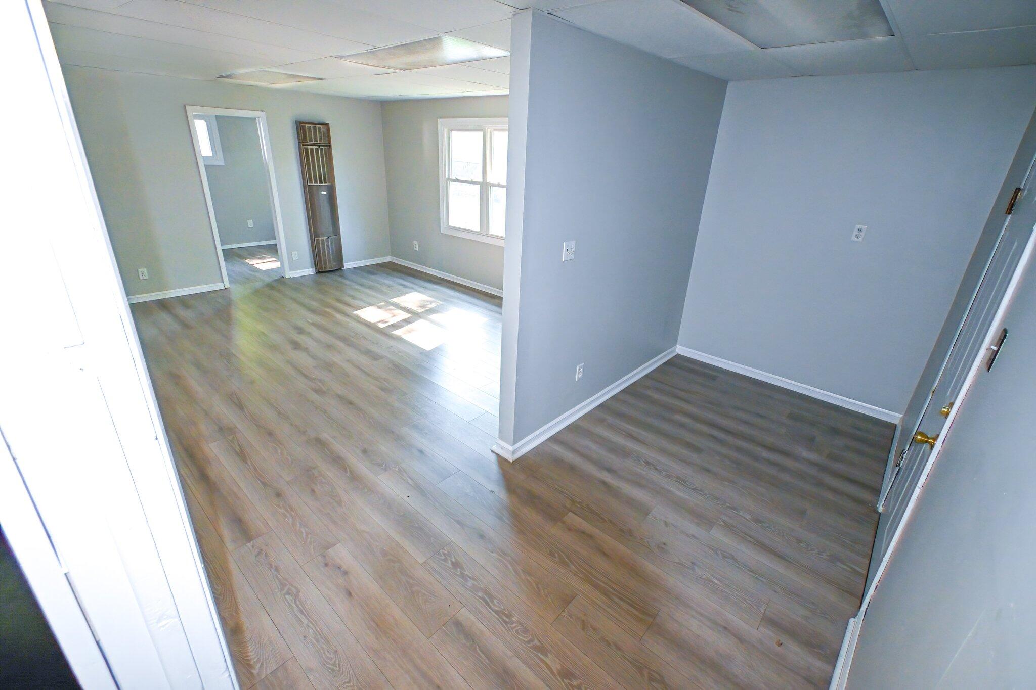 7828 Chestnut Avenue Hammond, IN 46324 - Photo 18 of 23 wooden floor in an empty room with windows