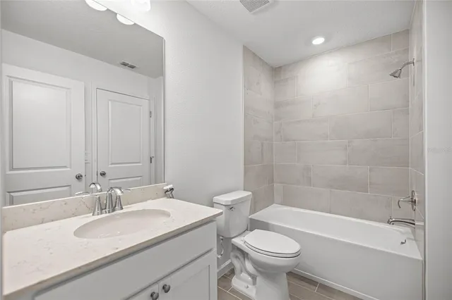 a bathroom with a sink a toilet and a bathtub