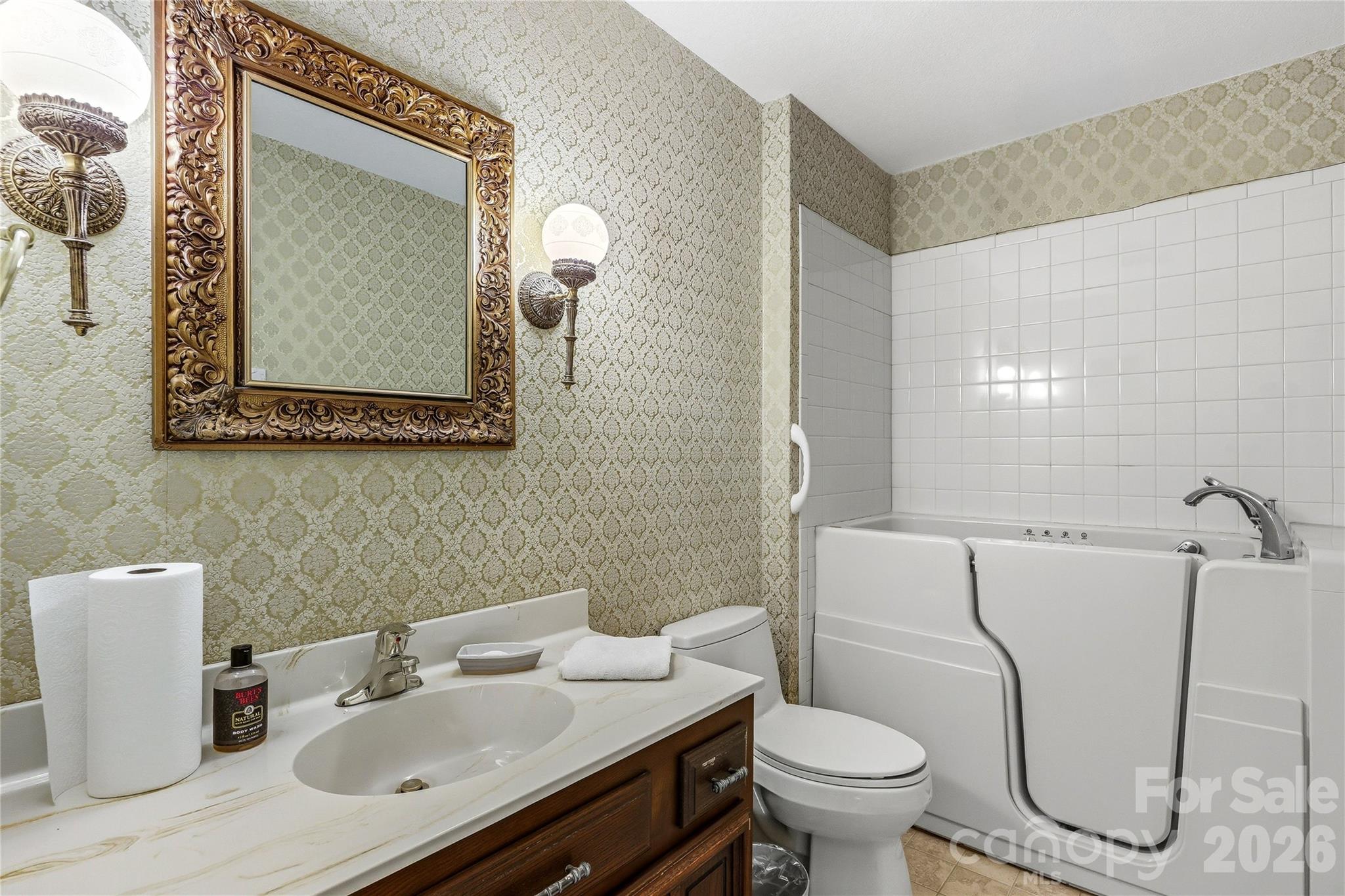 910 Rutledge Annex Hendersonville, NC 28739 - Photo 15 of 45 a bathroom with a toilet sink and mirror