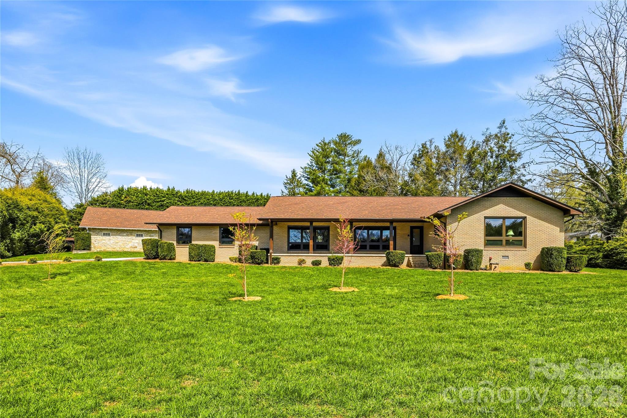 910 Rutledge Annex Hendersonville, NC 28739 - Photo 2 of 45 a view of a house with a big yard