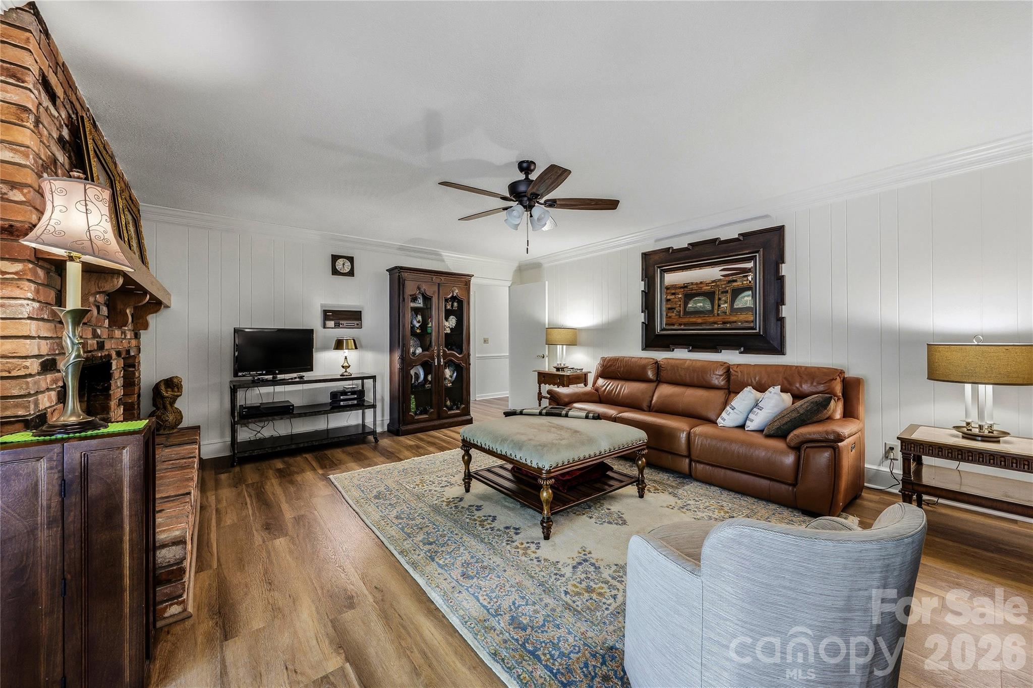 910 Rutledge Annex Hendersonville, NC 28739 - Photo 22 of 45 a living room with furniture and a flat screen tv
