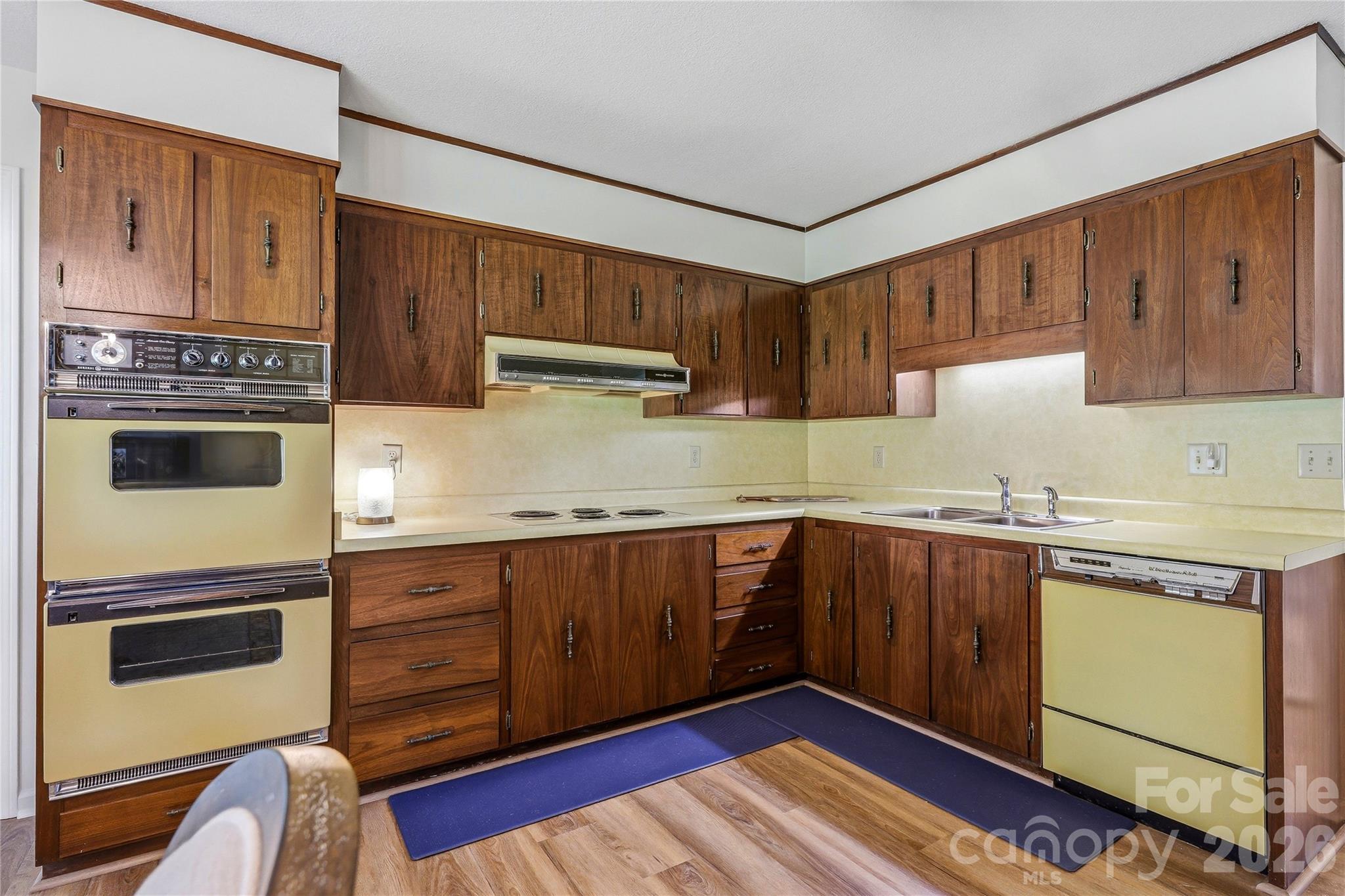 910 Rutledge Annex Hendersonville, NC 28739 - Photo 29 of 45 a kitchen with granite countertop wooden cabinets and white appliances