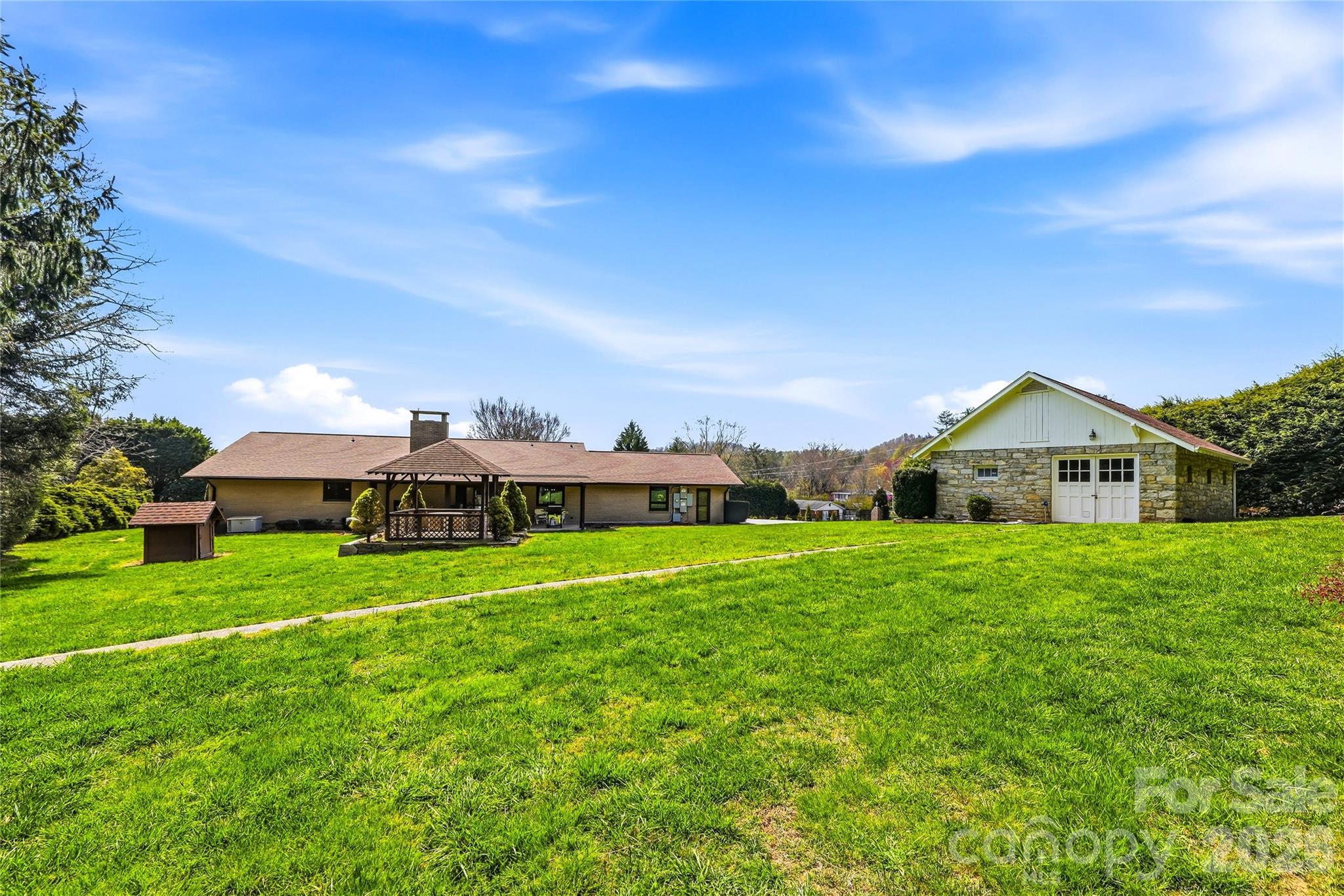 910 Rutledge Annex Hendersonville, NC 28739 - Photo 32 of 45 a view of a big yard with a house in the background