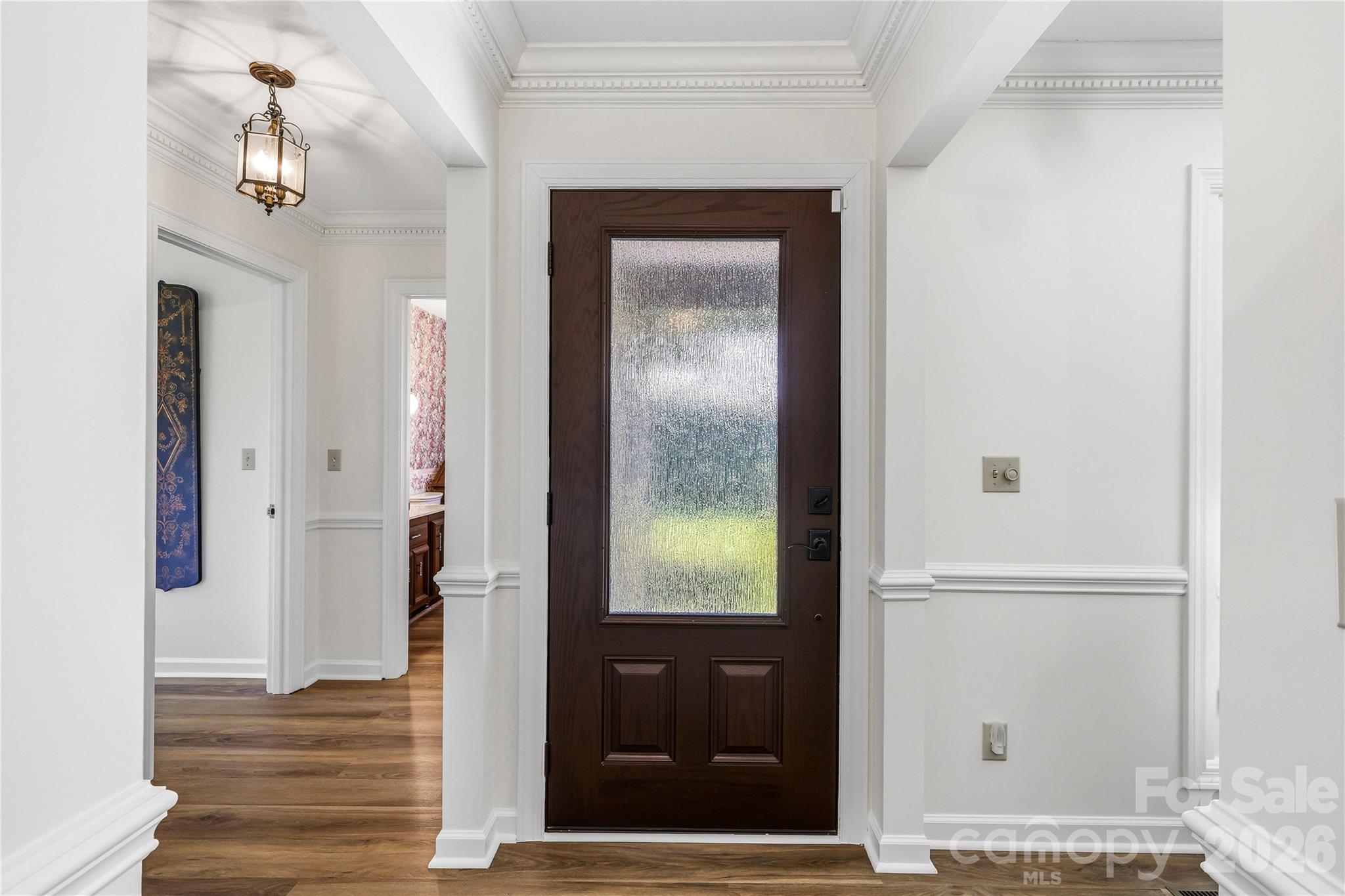 910 Rutledge Annex Hendersonville, NC 28739 - Photo 8 of 45 a view of a hallway with wooden floor and a living room