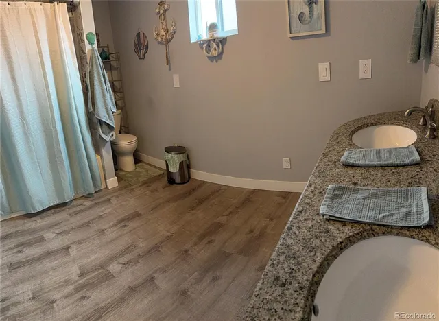 a room with furniture pool table gym equipment mirrors and window