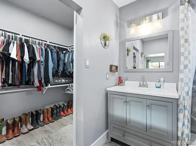 a view of a room with wooden floor and window