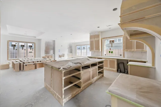 a kitchen with stainless steel appliances granite countertop a stove and a sink