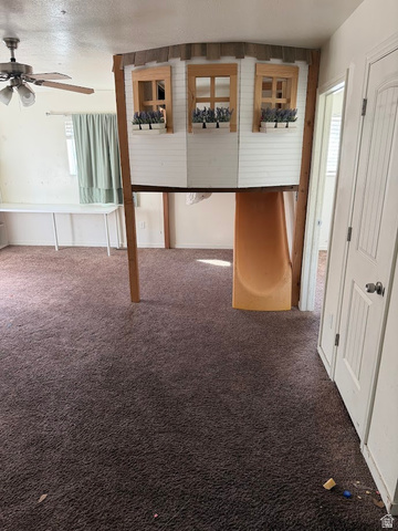 695 West 760 South Logan, UT 84321 - Photo 4 of 5 Hall featuring carpet floors and a textured ceiling