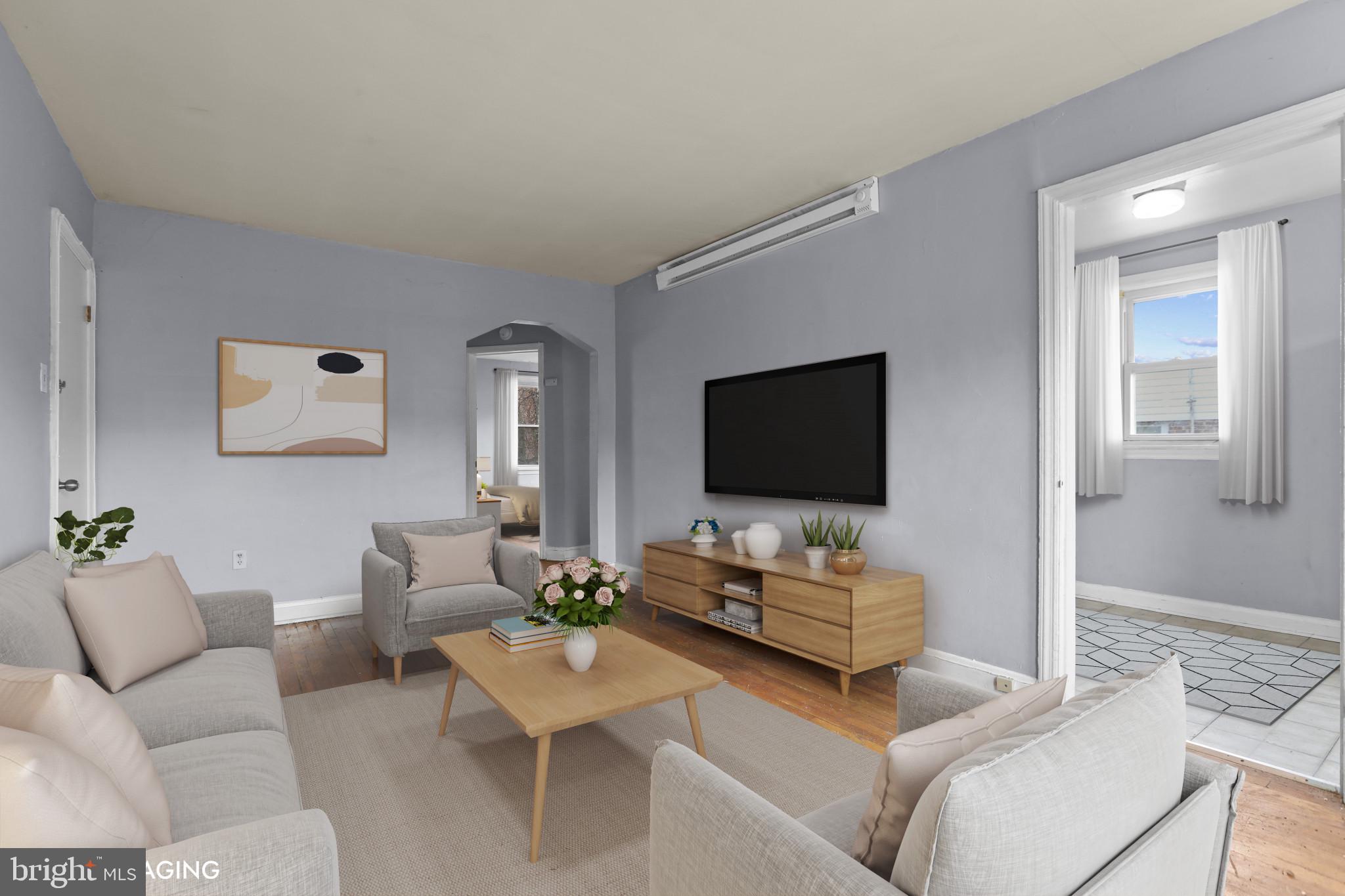 4511 Fairfax Road Baltimore, MD 21216 - Photo 7 of 35 a living room with furniture and a flat screen tv