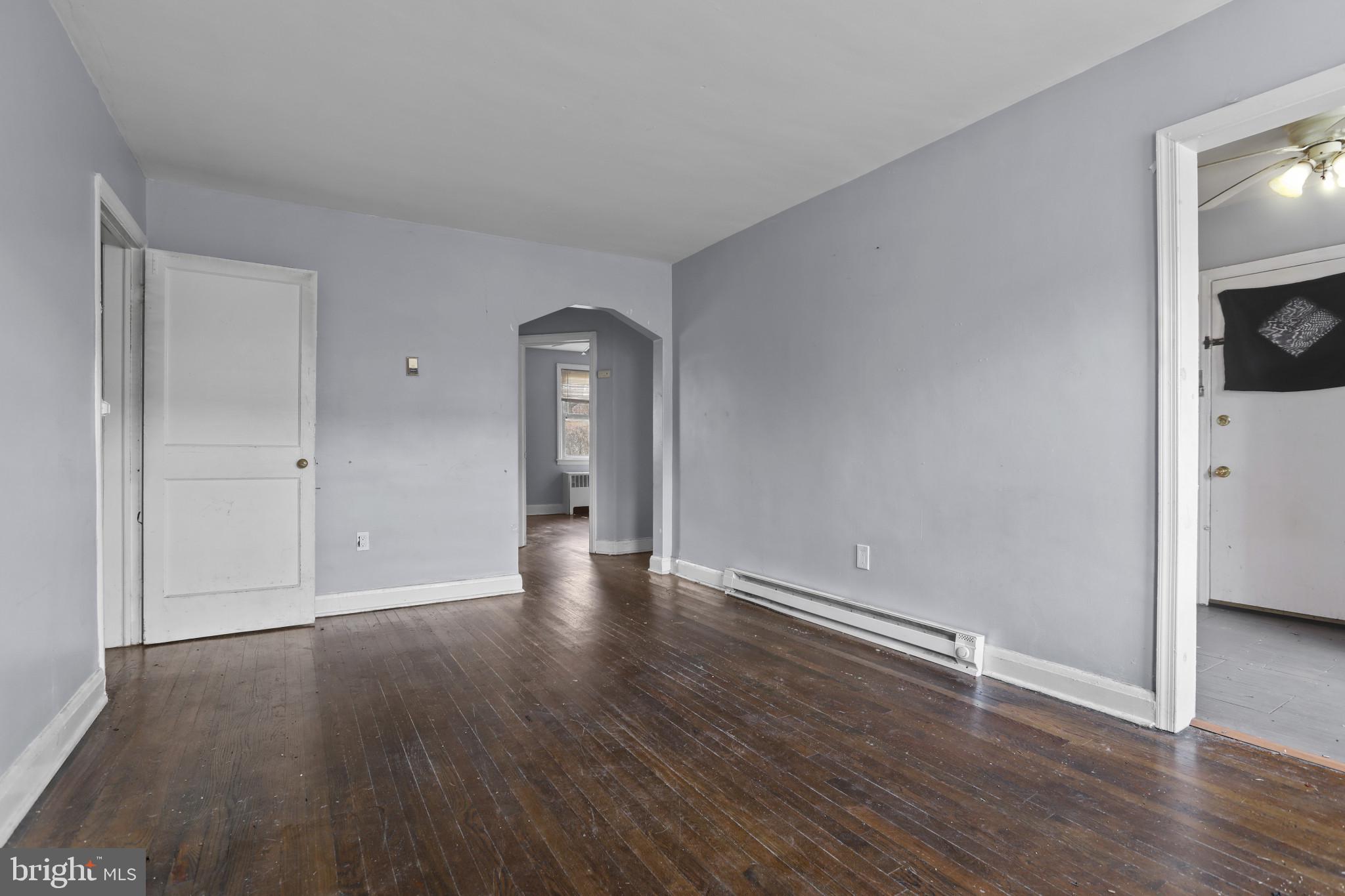 4511 Fairfax Road Baltimore, MD 21216 - Photo 9 of 35 wooden floor in an empty room