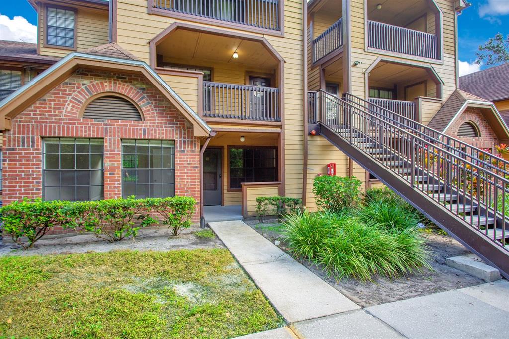 415 Lakepointe Drive, Unit 102 Altamonte Springs, FL 32701 - Photo 1 of 1 a front view of a house with garden