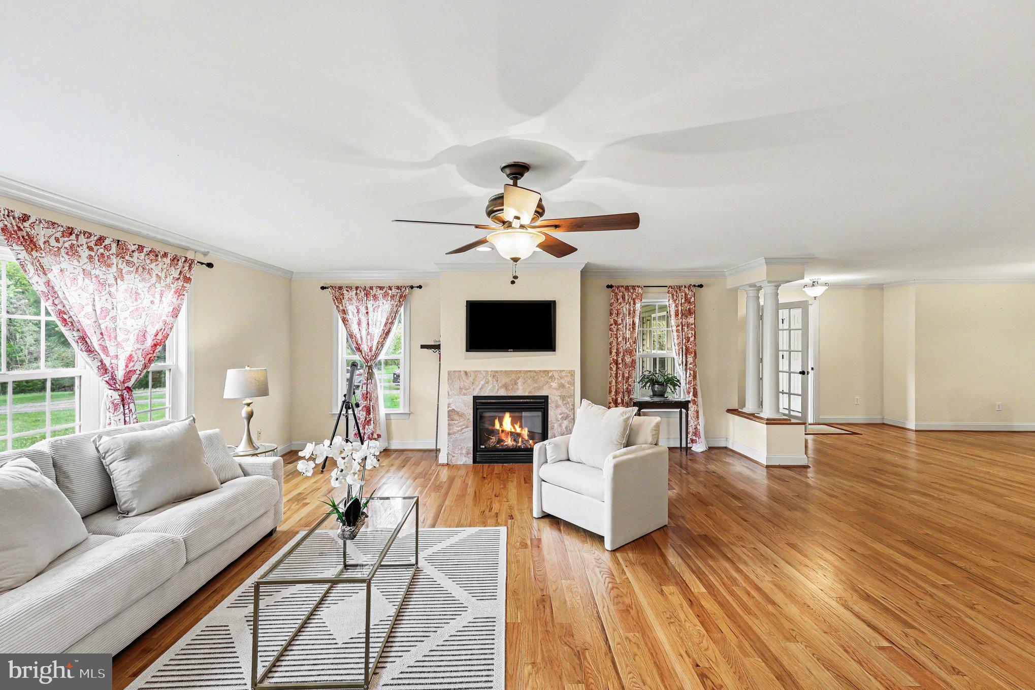 1564 Perry Road Winchester, VA 22602 - Photo 15 of 42 a living room with fireplace furniture and a flat screen tv