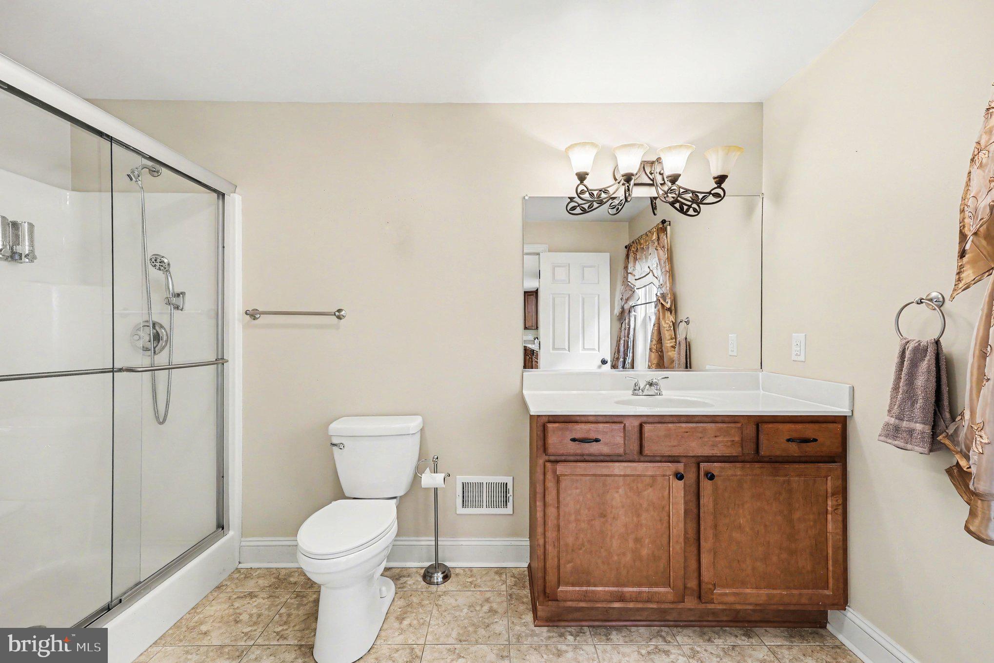 1564 Perry Road Winchester, VA 22602 - Photo 27 of 42 a bathroom with a toilet sink and mirror