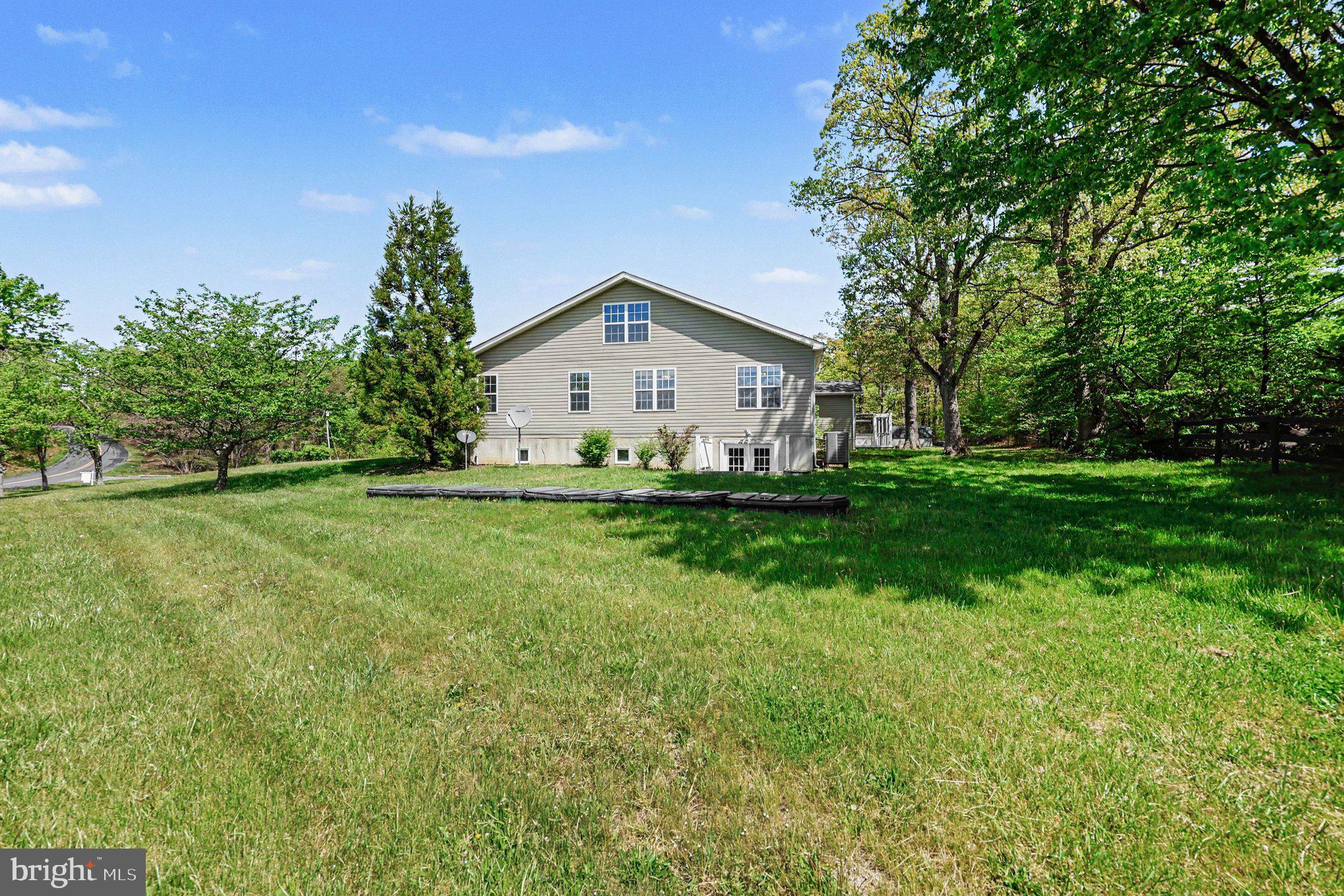 1564 Perry Road Winchester, VA 22602 - Photo 31 of 42 a front view of a house with garden