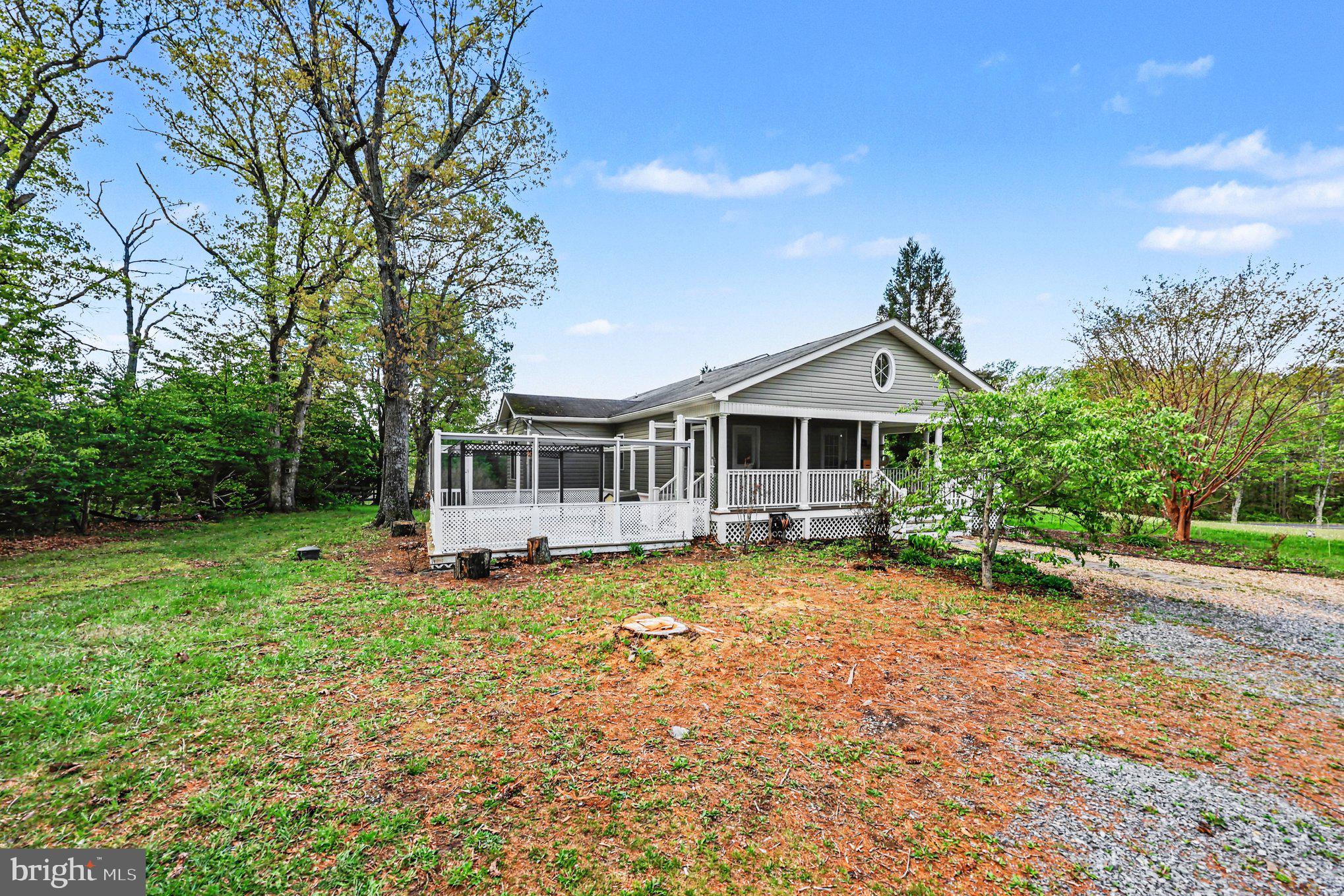 1564 Perry Road Winchester, VA 22602 - Photo 4 of 42 a front view of a house with a garden