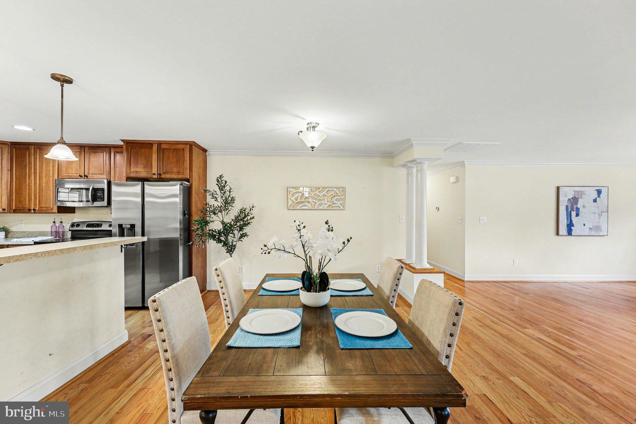 1564 Perry Road Winchester, VA 22602 - Photo 8 of 42 a view of a dining room with furniture and wooden floor