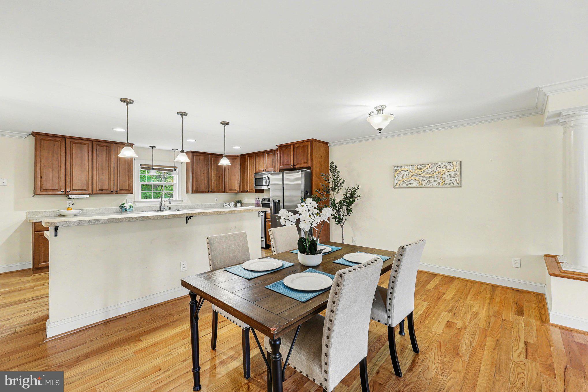 1564 Perry Road Winchester, VA 22602 - Photo 9 of 42 a kitchen with a table and chairs in it