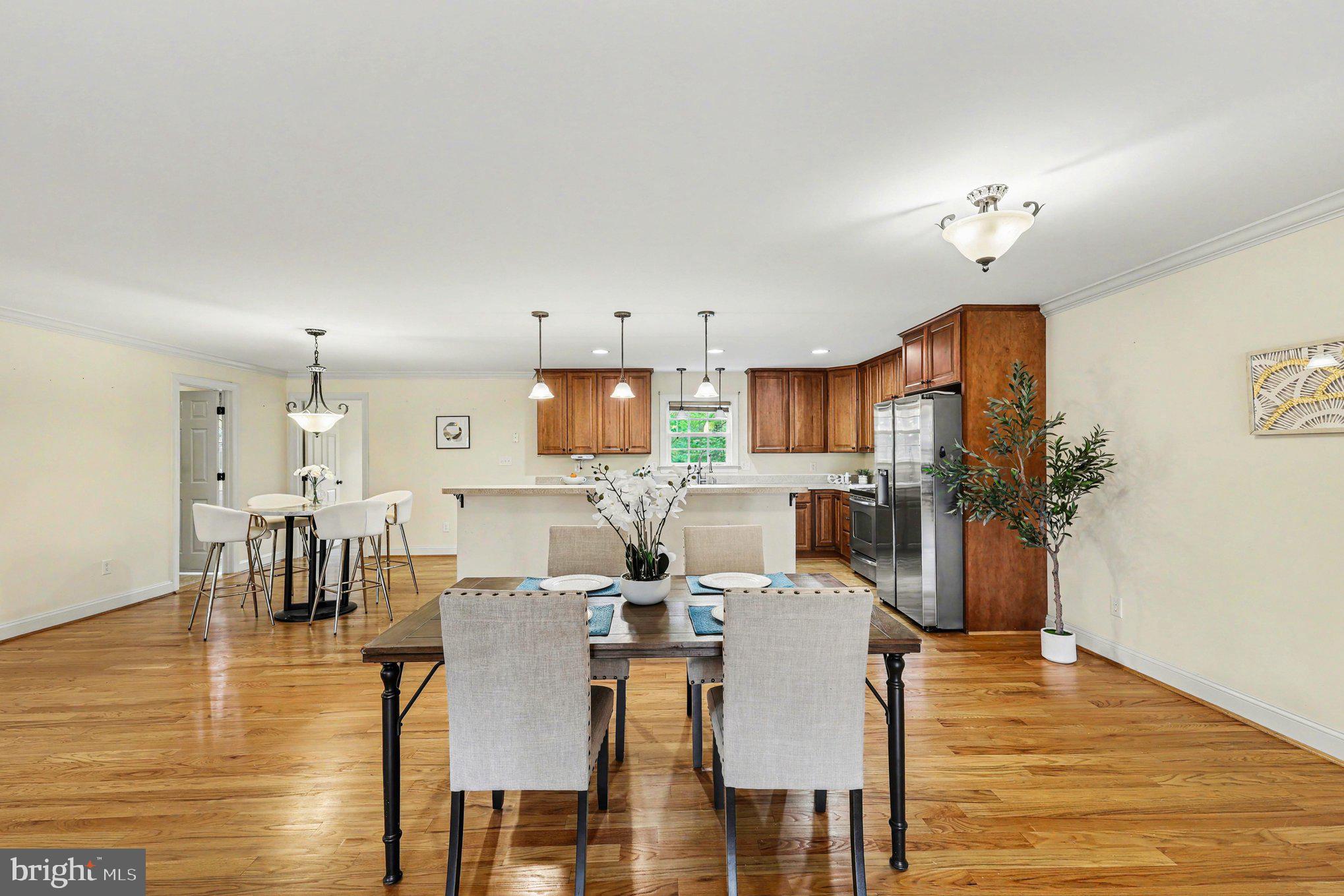 1564 Perry Road Winchester, VA 22602 - Photo 10 of 42 a view of a dining room with furniture and wooden floor