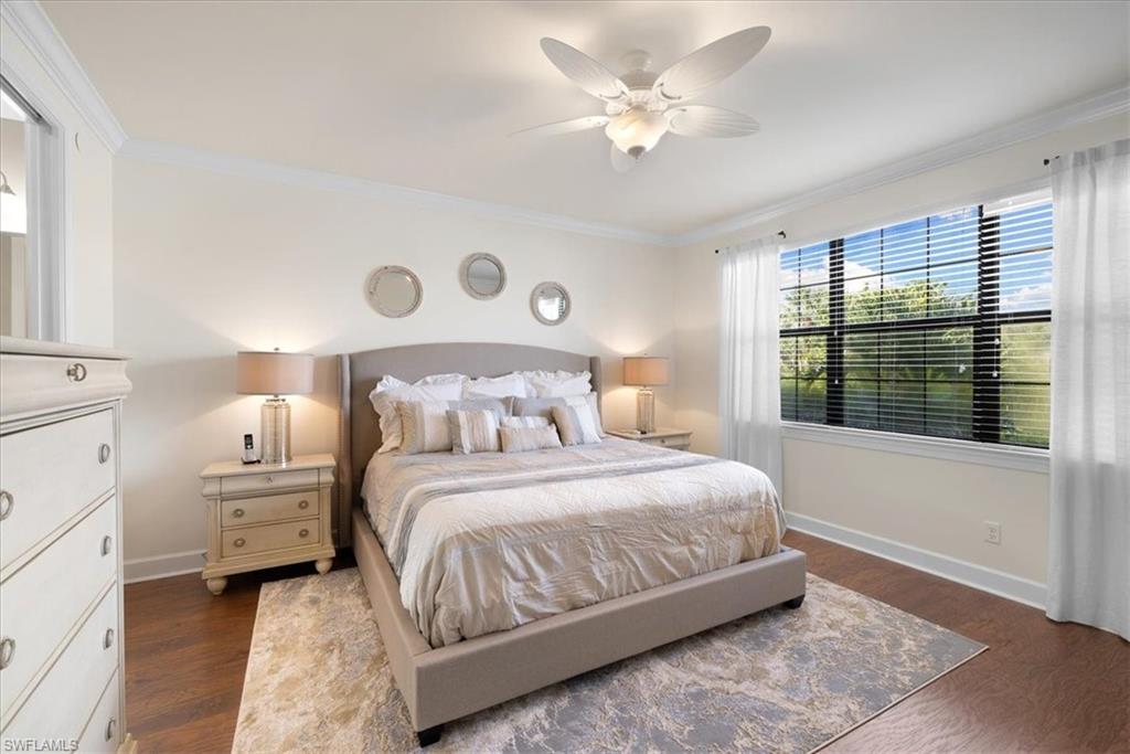 9684 Montelanico Loop, Unit 102 Naples, FL 34119 - Photo 14 of 24 a bedroom with a large bed and a window