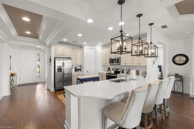 a kitchen with refrigerator and cabinets