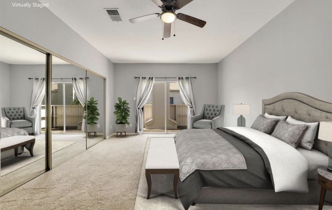 3800 Tanglewilde Street West, Unit 806 Houston, TX 77063 - Photo 5 of 12 a bedroom with a bed and a chandelier