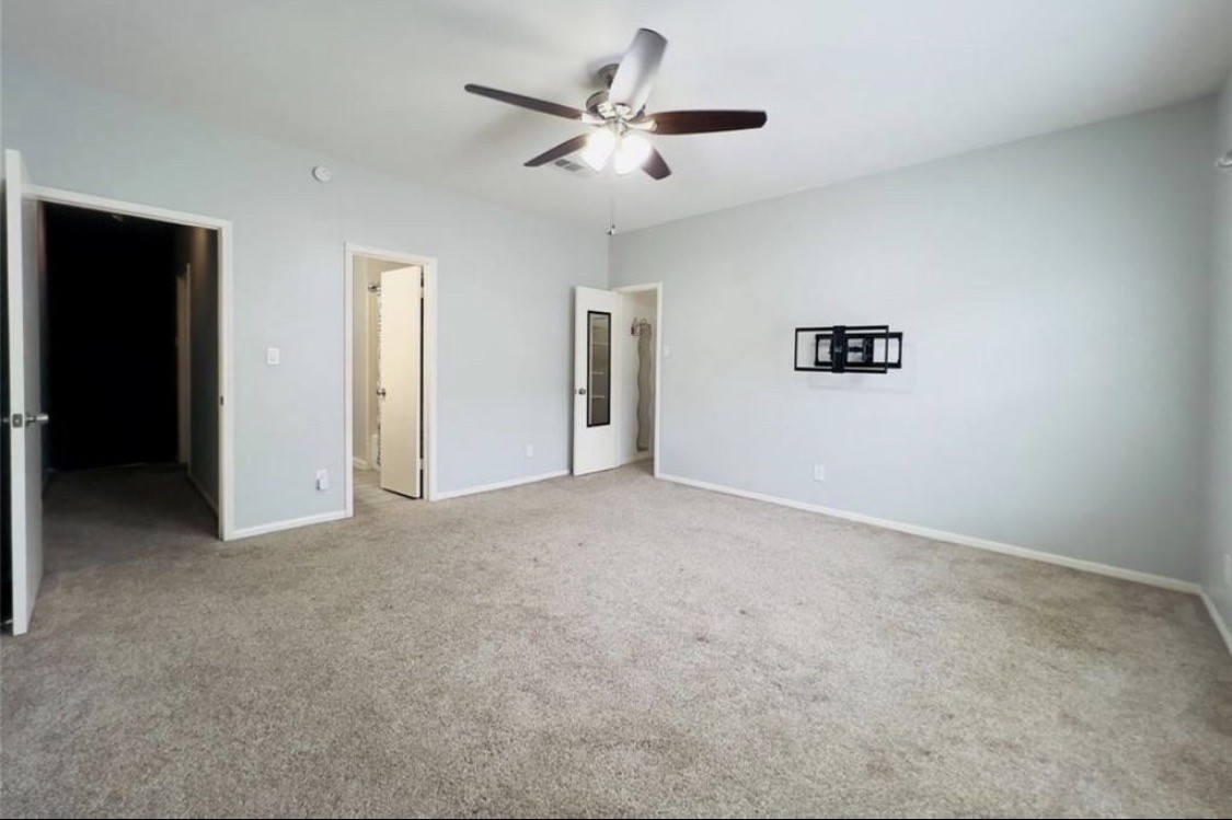 3800 Tanglewilde Street West, Unit 806 Houston, TX 77063 - Photo 7 of 12 a view of a livingroom with a ceiling fan