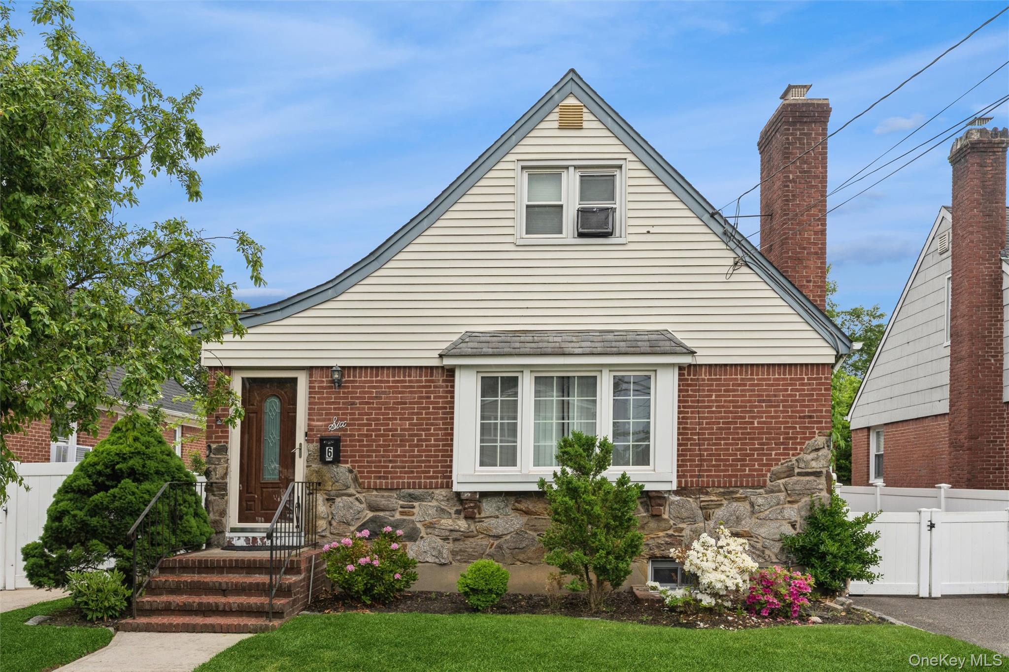 6 Jasper Street Valley Stream, NY 11580 - Photo 1 of 19 a front view of a house with a yard