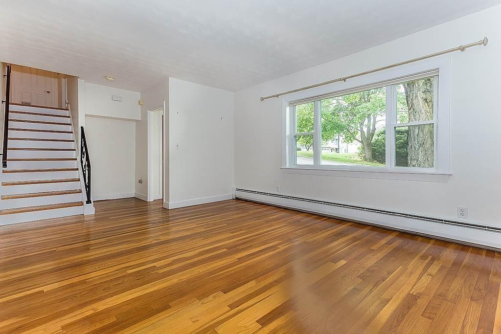 4 Hinds Road Winchester, MA 01890 - Photo 16 of 37 a view of an empty room with wooden floor and a window