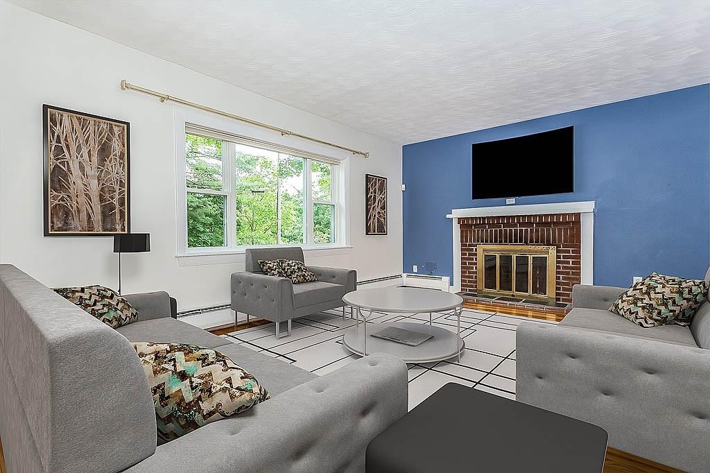 4 Hinds Road Winchester, MA 01890 - Photo 5 of 37 a living room with furniture and a flat screen tv