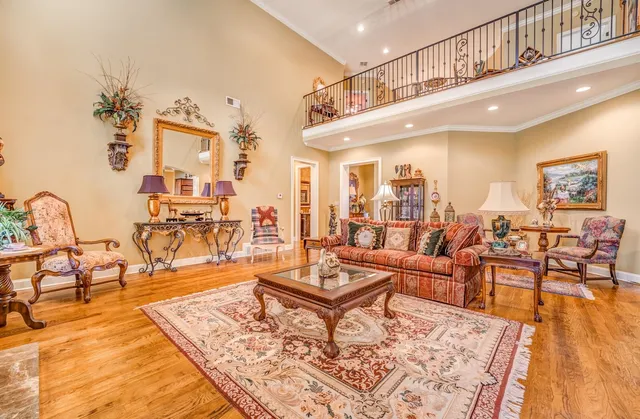 a living room with lots of furniture and wooden floor