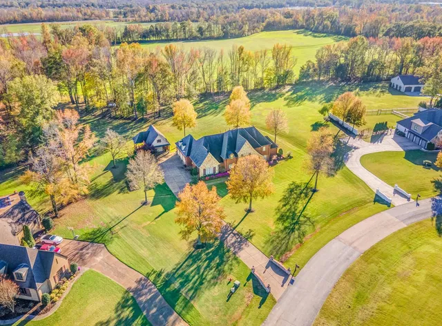 an aerial view of residential houses with swimming pool