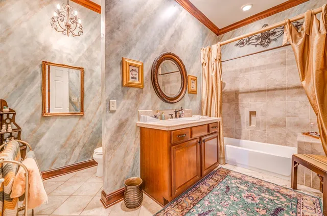 a bathroom with a sink a mirror and a shower