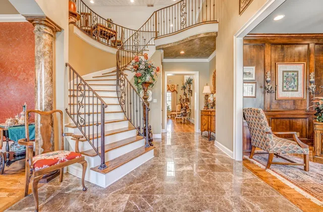 a view of a porch with furniture and a gate