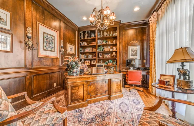 a living room filled with furniture and a chandelier
