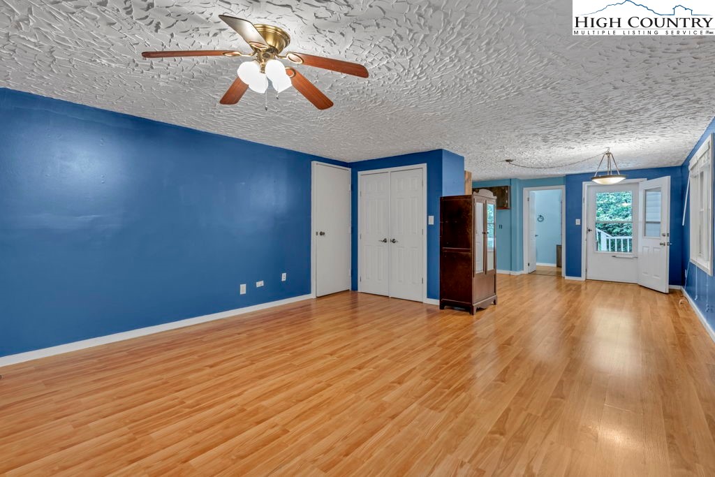 450 Astor Cook Road Blowing Rock, NC 28605 - Photo 28 of 39 a view of an empty room with window and wooden floor