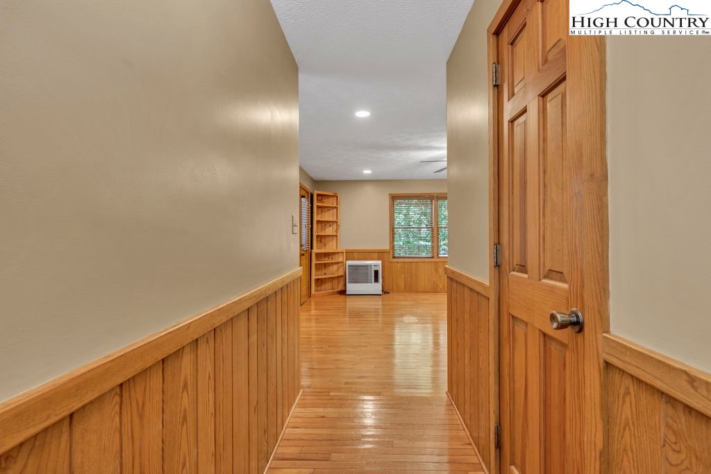 450 Astor Cook Road Blowing Rock, NC 28605 - Photo 3 of 39 a view of a hallway with the view of the house and wooden floor