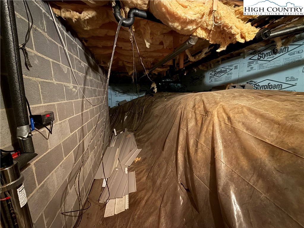 450 Astor Cook Road Blowing Rock, NC 28605 - Photo 31 of 39 a view of walk in closet with clothes and shoes